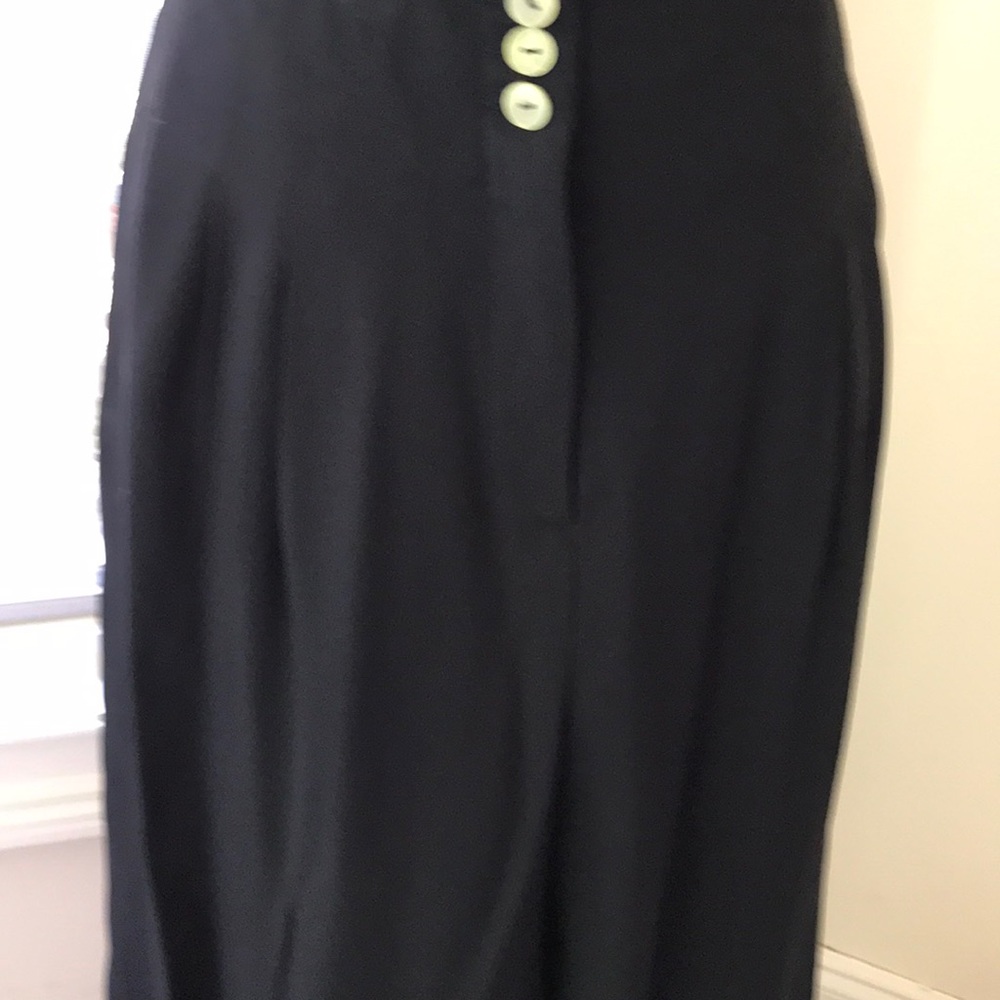 Pant suit . interesting weave look in fabric. Clad